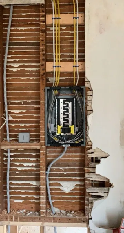 Electrical panel rough-in with new circuit wiring during a home addition